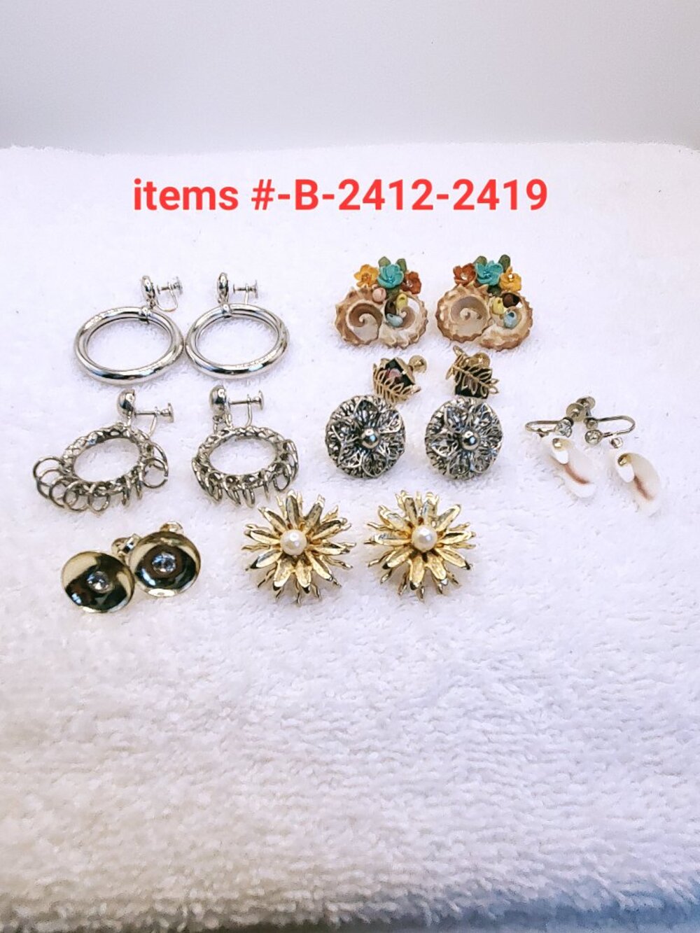 8 Pair of screw on Earrings, items # B-2412-2419,. wt.69 grams .